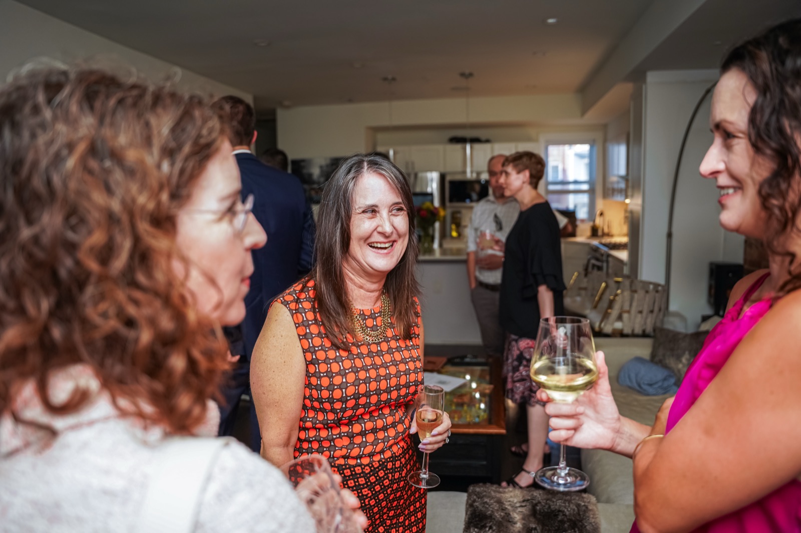 Attendees networking and talking with one another at a DC Fiduciaries event.