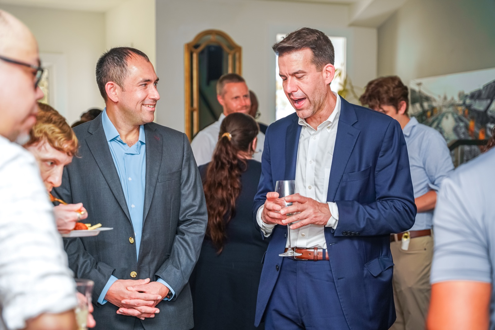 Referral partners in conversation at a DC Fiduciaries event.