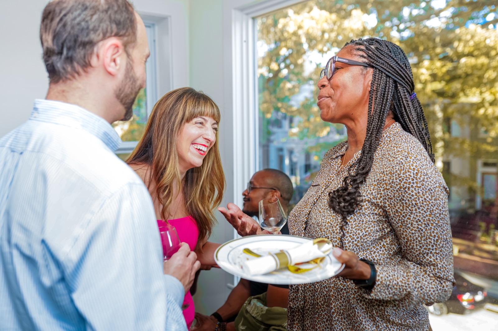Judith del Cuadro-Zimmerman talking with a guest at the DCZ Legal launch party.